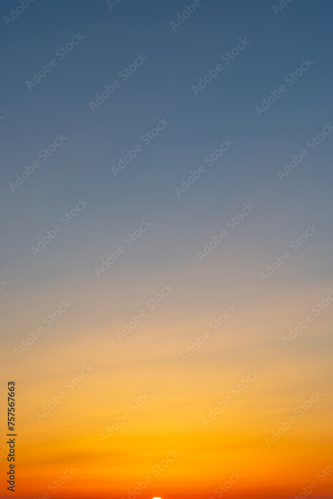 Sunrise sky with an orange-to-blue gradient