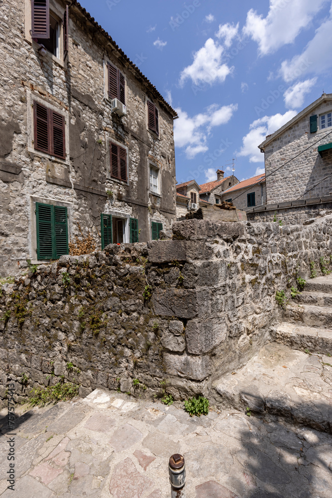 A narrow street in the Old Town near the Old Walls. Typical architecture of Mediterranean cities, Kotor, Montenegro