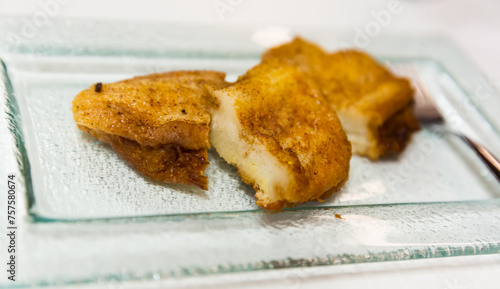 Delicious Madrilian torrijas - traditional Spanish dish from bread soaked in milk or wine with honey and spices..