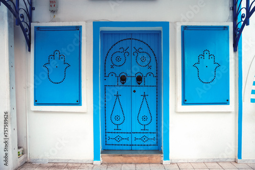 Blue door and window shutters in Houmt Souk city on Djerba Island, Tunisia photo