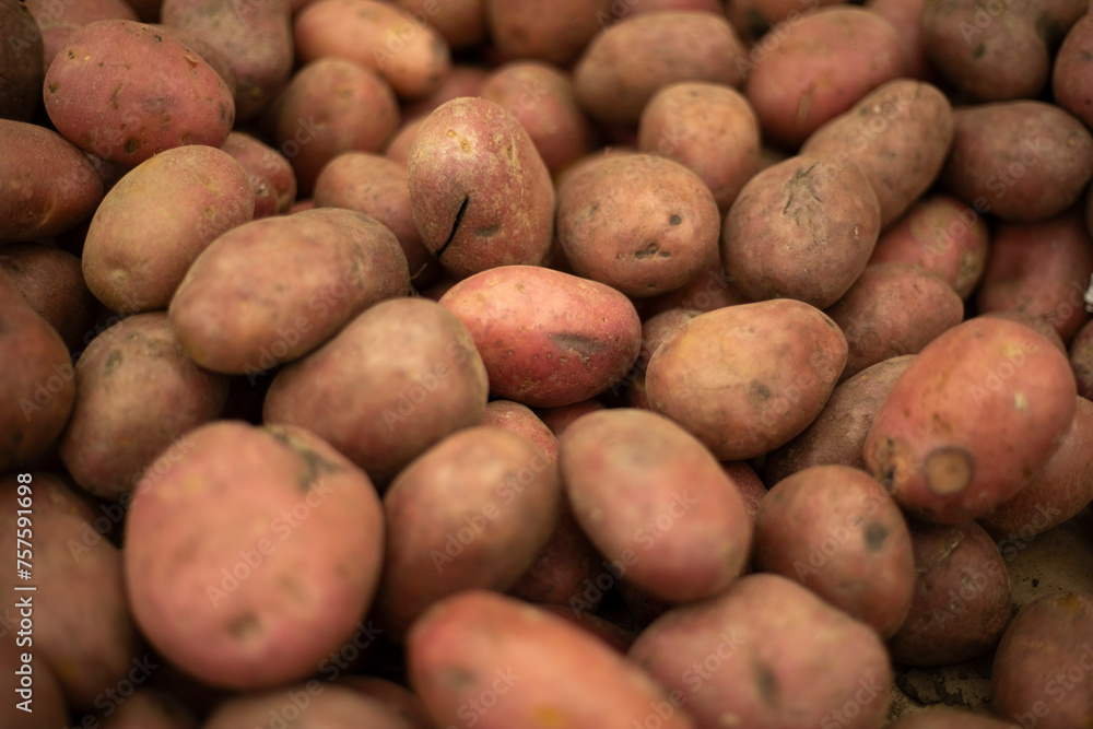 Potatoes on the market. Root vegetable texture. Large size potatoes. Potatoes on the market. Root vegetable texture. Large size potatoes.