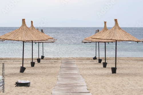 Fototapeta Naklejka Na Ścianę i Meble -  Sunbeds, Umbrellas and Hammocks in a beach