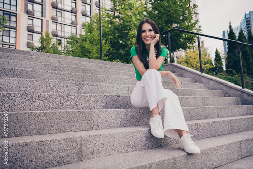 Photo of stunning cheerful woman dressed trendy clothes walking in city enjoying summer free time weekend evening outside #757592248