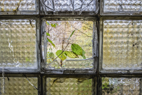 Glass bricks in school in Illinci abandoned village in Chernobyl Exclusion Zone, Ukraine photo