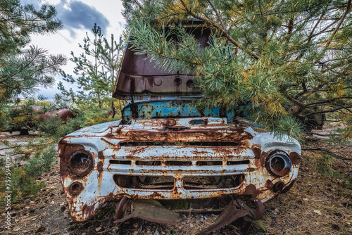 Old car on wrecking yard near Illinci village in Chernobyl Exclusion Zone in Ukraine