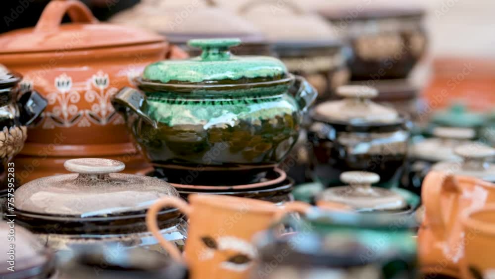 People buying ceramic dishes, tableware and jugs sold sold on Kaziukas, Easter market in Vilnius. Lithuanian capital's annual traditional crafts fair is held every March on Old Town streets. People buying ceramic dishes, tableware and jugs sold sold on Kaziukas, Easter market in Vilnius. Lithuanian capital's annual traditional crafts fair is held every March on Old Town streets.
