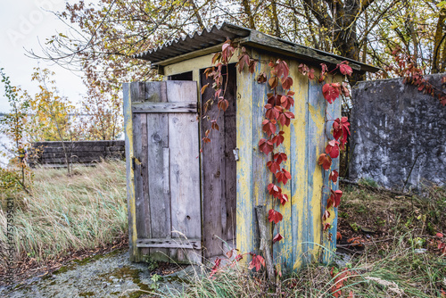 Wooden privy in abandoned Radioecology Laboratory in former fish farm in Chernobyl Exclusion Zone, Ukraine