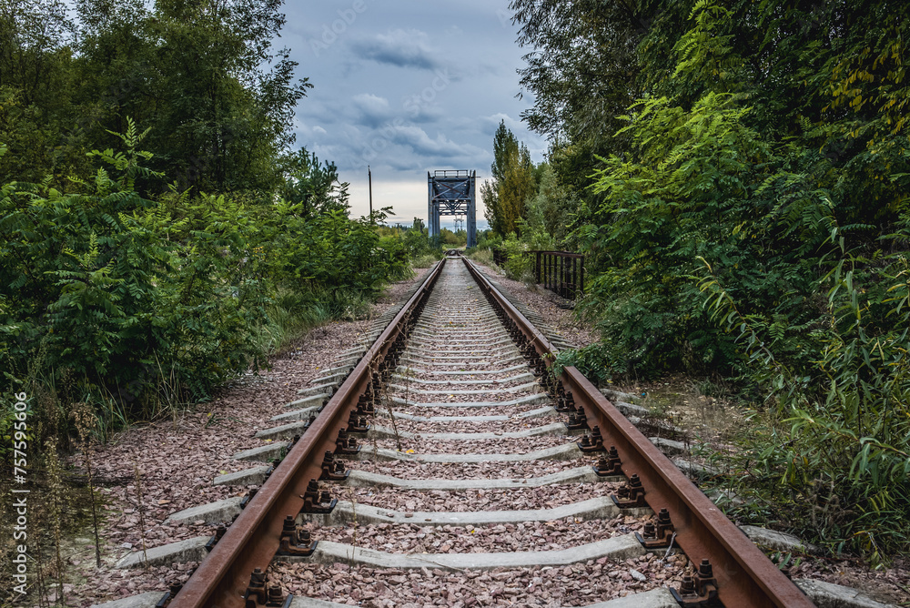 Obraz premium Railway track near railway track near Chernobyl Nuclear Power Plant in Chernobyl Exclusion Zone, Ukraine