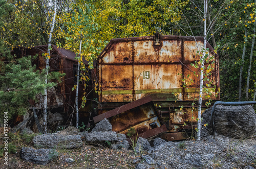 Old wagon near Unfinished cooling tower of reactor 5 of Chernobyl Nuclear Power Plant in Chernobyl Exclusion Zone, Ukraine