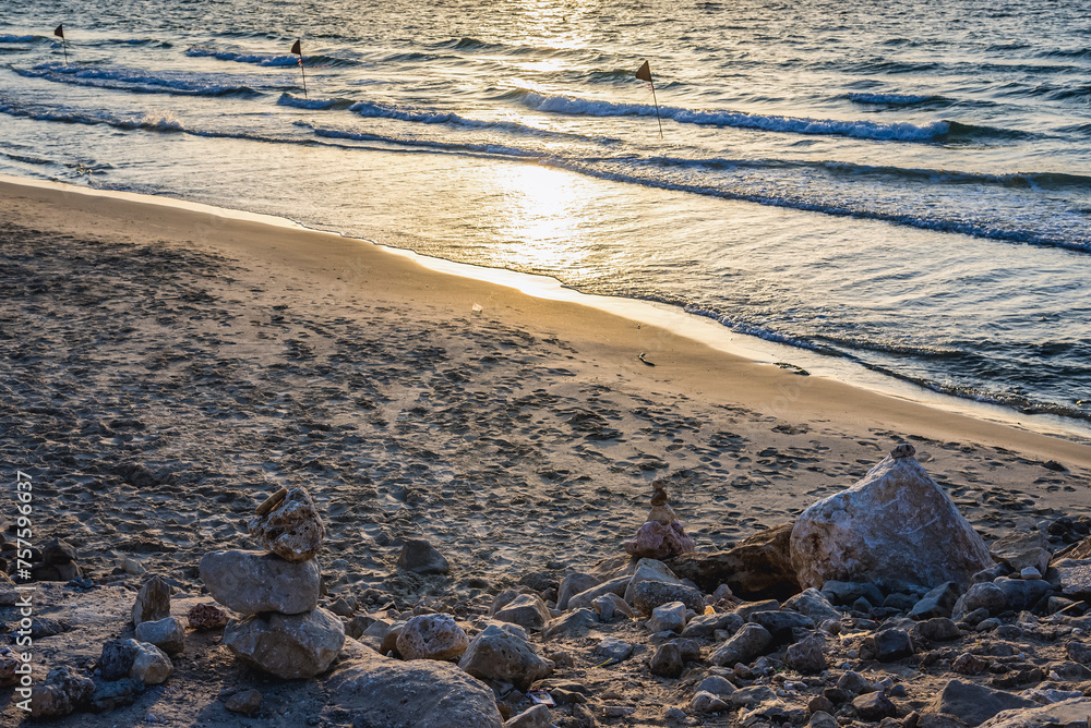 Fototapeta premium Sunset over Mediterranean Sea seen from the beach in Tel Aviv city, Israel