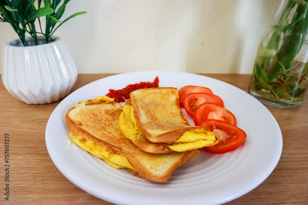 Simple breakfast menu, bread toast with egg and tomato