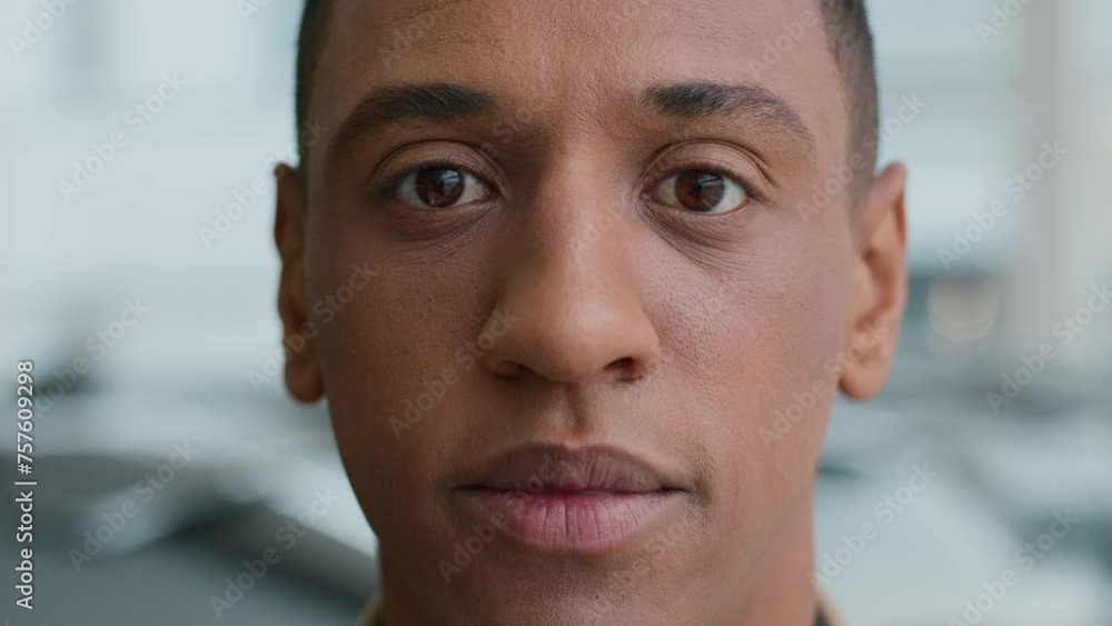 Close-up in details serious worried african american man raise head looking at camera sad face tired gaze dark eyes pensive frustrated upset ethnic male 30s guy businessman client ophthalmology clinic Close-up in details serious worried african american man raise head looking at camera sad face tired gaze dark eyes pensive frustrated upset ethnic male 30s guy businessman client ophthalmology clinic