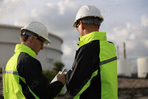 Chief of Construction engineer planning and briefing for safety and building a factory in oil refinery plant, cooperation work together teamwork concept.