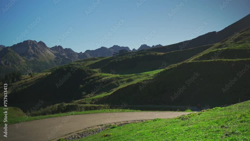 Bicycle against background of Alps in Germany. E bike on background of mountains Allgaeu High Alps with no person. Fahrradtour. Bicycle rental. Electric bike for rent in Oberstdorf, Bavaria. Bicycle against background of Alps in Germany. E bike on background of mountains Allgaeu High Alps with no person. Fahrradtour. Bicycle rental. Electric bike for rent in Oberstdorf, Bavaria.