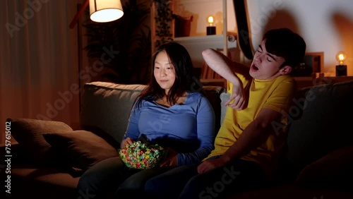 Romantic teenager couple embracing at the first date. Nervous boy pretending to be tired to hug girlfriend. Valentines day concept