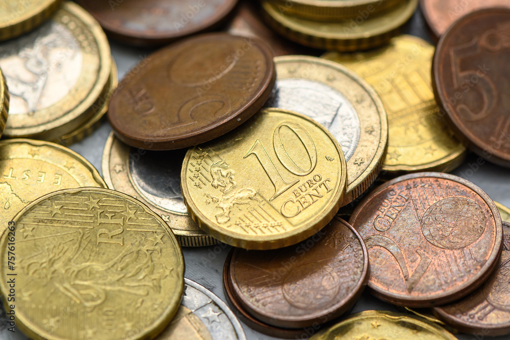 Euro coins scattered on the table as a background 1 Euro coins scattered on the table as a background 1