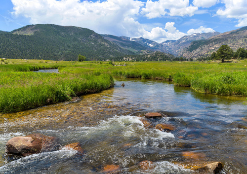 Summer at Moraine Park - A panoramic view of Big Thompson River flowing through green meadow of Moraine Park Valley on a calm and sunny Summer day. Rocky Mountain National Park, Colorado, USA. © Sean Xu