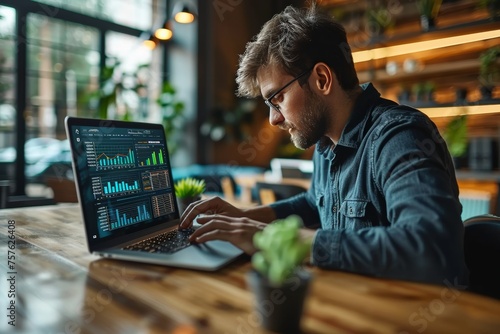 Businessman examines financial data on laptop, stock market trends, investment concept