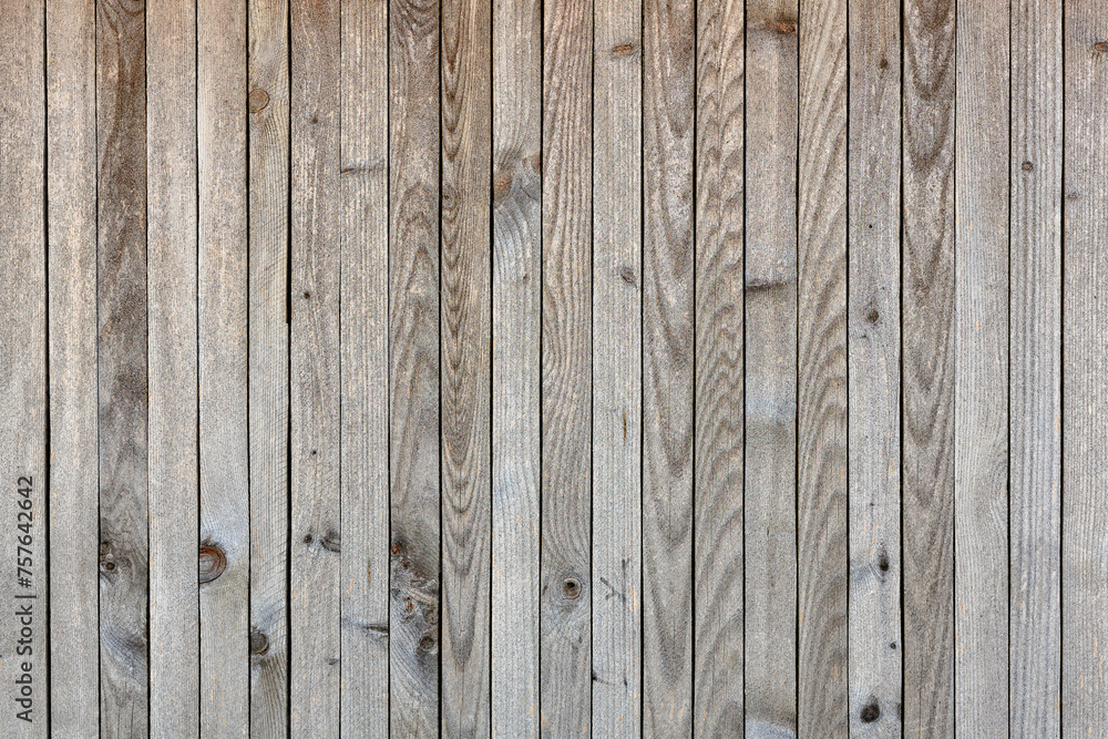 The image is a close up of a wooden wall with a grainy texture The image is a close up of a wooden wall with a grainy texture