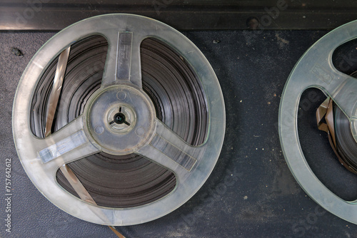 Two old film reels are sitting on a table