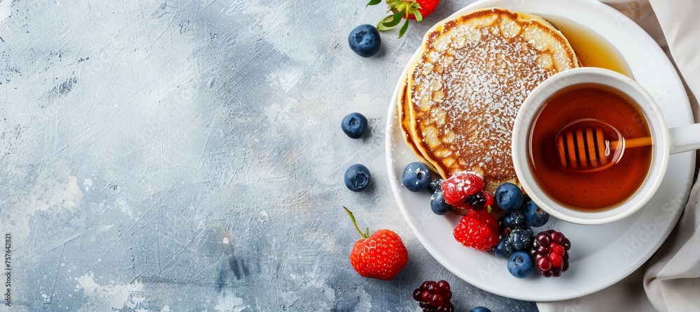 Cute tiger face pancake with berries and honey on white plate, bright background with copy space Cute tiger face pancake with berries and honey on white plate, bright background with copy space