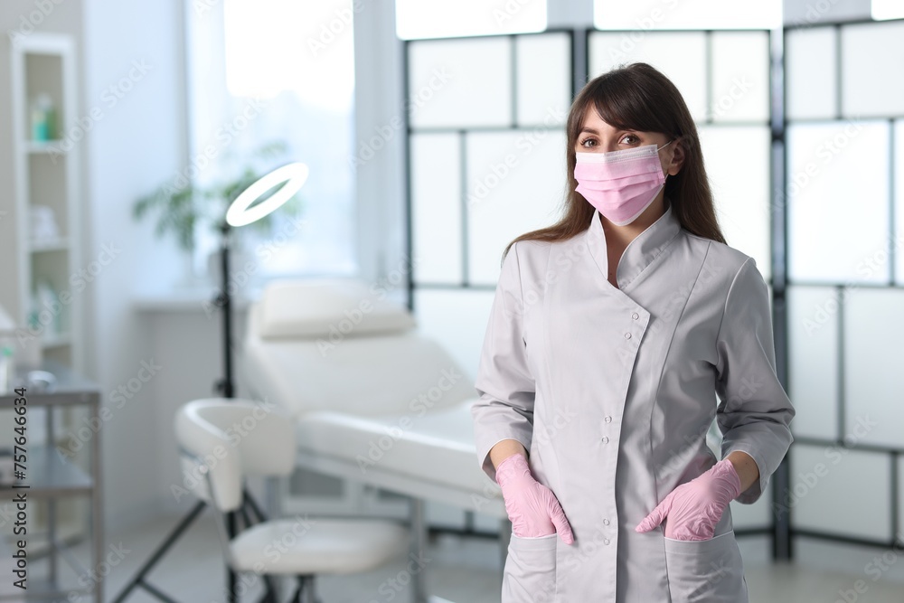 Cosmetologist in medical uniform in clinic, space for text Cosmetologist in medical uniform in clinic, space for text