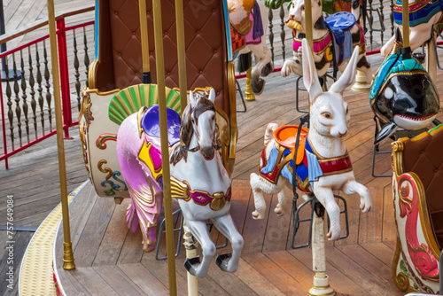 Photography a colorful Merry Go Round with a rabbit, a killer whale and a seahorse at Fisher