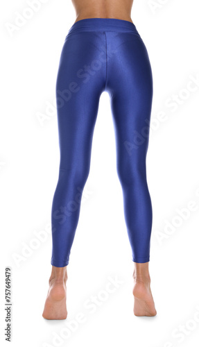 Woman with beautiful long legs wearing blue leggings on white background, closeup