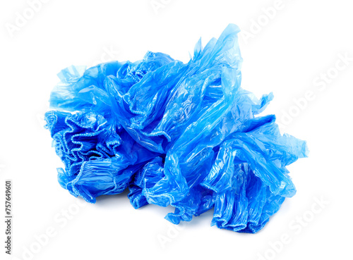Pile of many blue medical shoe covers isolated on white