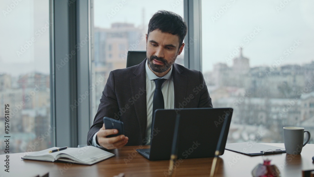 Boss answering phone call sitting modern office close up. Man dissatisfied talk Boss answering phone call sitting modern office close up. Man dissatisfied talk