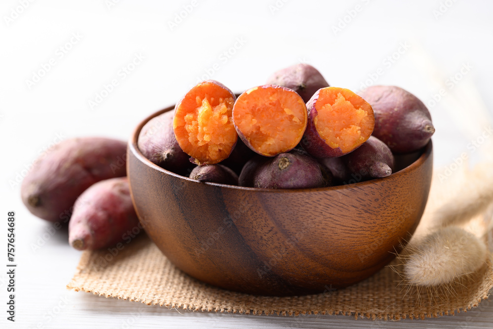 Boiled sweet potato on wooden bowl