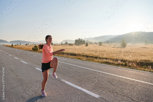 Determined Stretch  Athletic Woman Embraces Post-Run Flexibility in Nature.