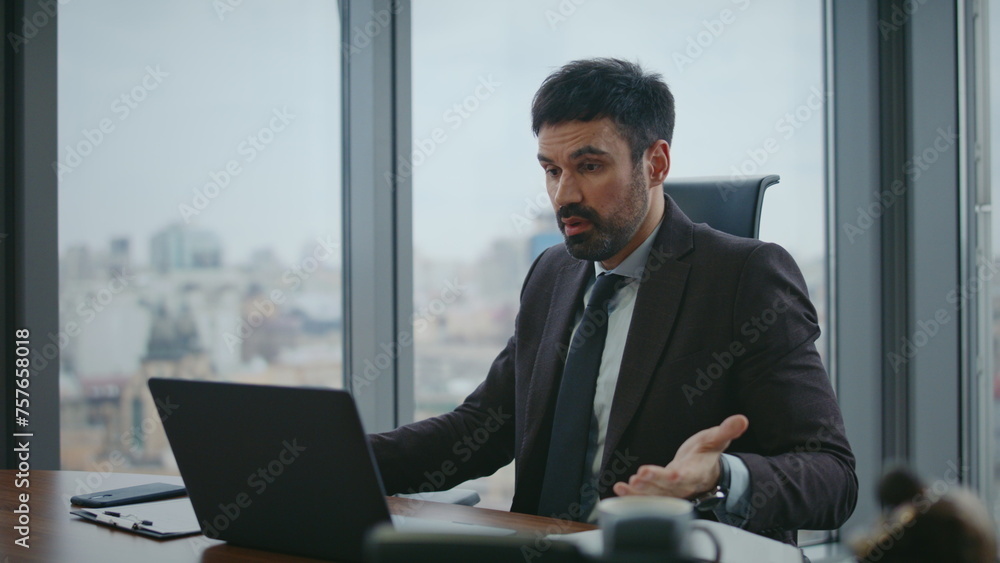 Businessman shouting video conference worried company loss in office close up. Businessman shouting video conference worried company loss in office close up.