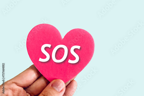SOSのハートを持つ人の手 photo