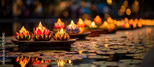 A serene natural landscape with a row of lit candles floating on top of the water. The tranquil scene creates a calming ambiance, perfect for a relaxing entertainment event