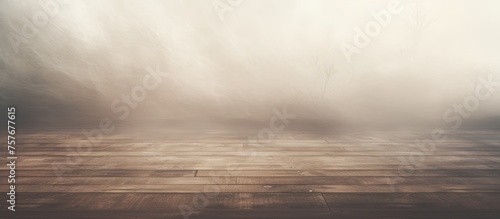A hazy view of a hardwood floor with billowing smoke creating a cloudlike effect against the sky, resembling a natural landscape event