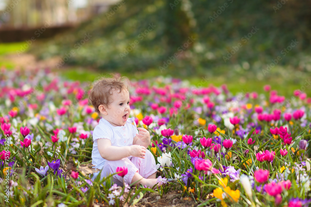 Child in spring park with flowers Child in spring park with flowers