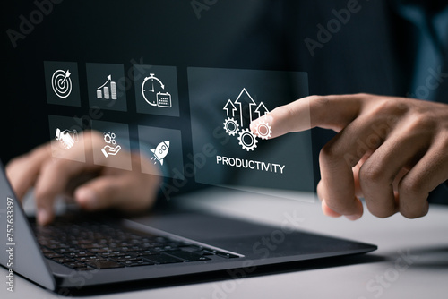 Process to increase productivity concept. Businessman use laptop with productivity icon for industrial management in efficiency and efficient process. Lean cost and productivity growth.