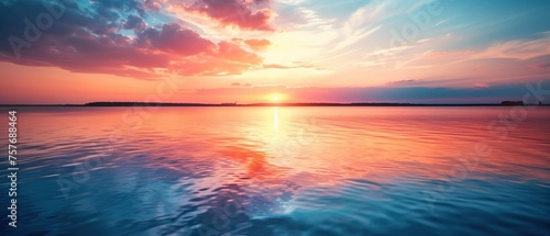 Sundown Serenity, A serene sunset painting the sky in hues of pink and orange as it dips below the horizon, its reflection casting a peaceful glow over the gentle ripples of the vast lake © auc