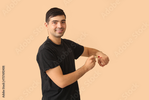 Male makeup artist with lip...