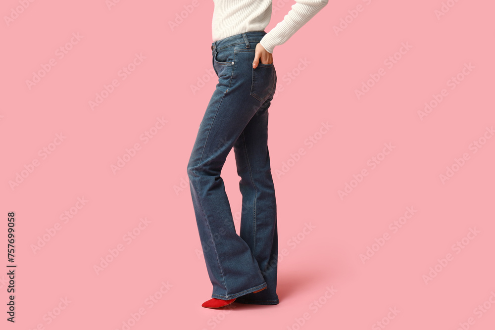 Naklejka premium Beautiful young Asian woman in stylish jeans on pink background, closeup