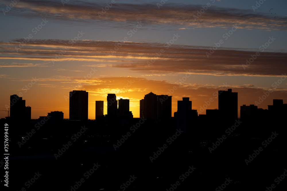 City Skyline Silhouetted at Sunset.
