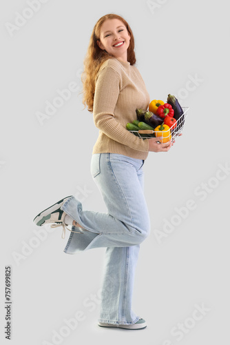 Young woman with basket of ...