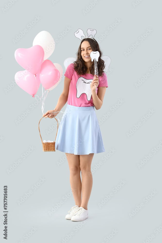 Tooth Fairy with wand and balloons on light background