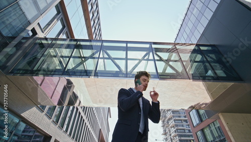 Business man arguing mobile phone call on street. Annoyed boss finish talk 