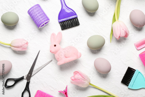 Hairdressing accessories with tulips, Easter eggs and bunny on white grunge background