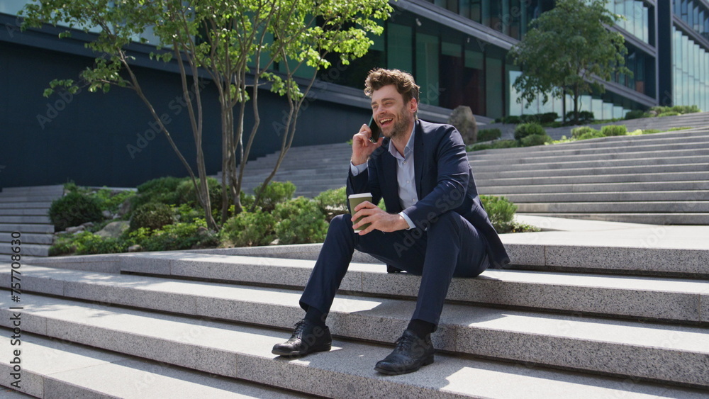 Manager enjoy smartphone conversation sitting street stairs at break close up. Manager enjoy smartphone conversation sitting street stairs at break close up.