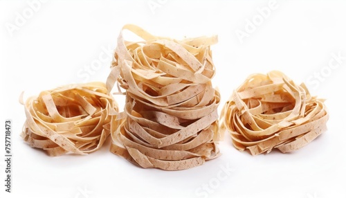 Whole grain pasta tagliatelle isolated on a white background. Heap of Tagliatelle integral,