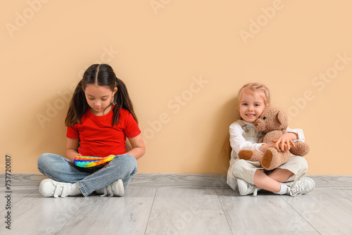 Little girl with toys near ...