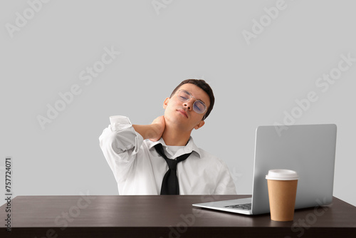 Tired young businessman at ...